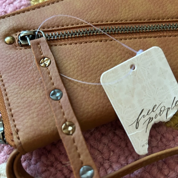 Free People Handbags - NWT gorgeous Vegan Free People Tan Leather Wristlet with Studded Strap.